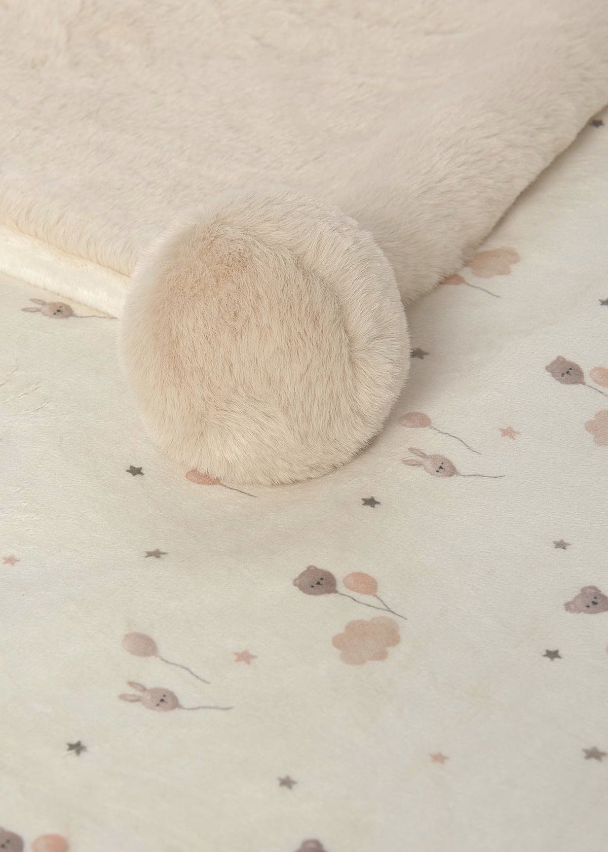 Manta com pompons para bebé
